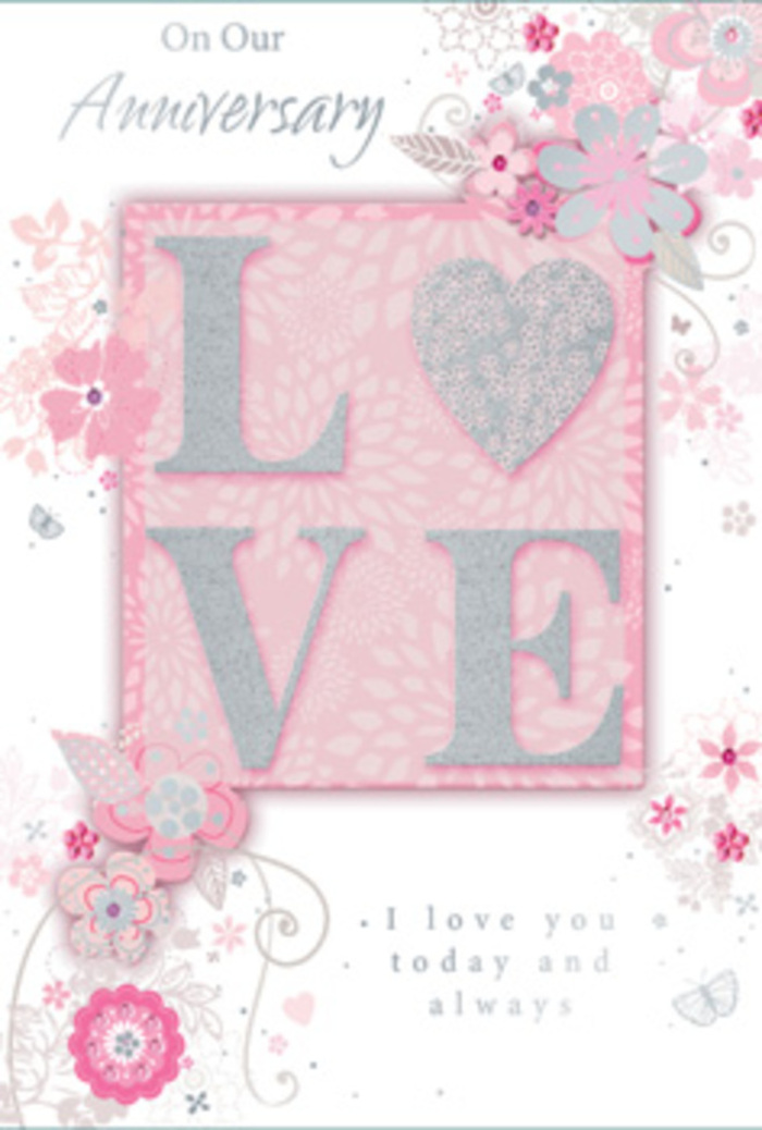 Shown in close detail, this anniversary card feels like stepping into a sun-bright room where love is quietly honoured every day, much like visiting a familiar café off Epsom High Street where couples linger over coffee. The central focus on the front is the word LOVE, its letters gently elevated and adorned with an elegant frosting of fine glitter. The textured finish gives each letter a soft, frosted sheen that catches light at different angles, creating a playful sparkle without losing its refined character. Around this central motif, wispy, hand-drawn flowers and soft sprays of foliage drift along the borders. The blooms appear in calming shades of pink, lilac, and ivory, blending seamlessly into one another, their petals lightly shaded to suggest depth and softness. The line work is delicate, like the first strokes of a florist sketching out a bouquet before gathering real stems and petals on the workbench. Interwoven between the blossoms are fine flourishes-filigree lines, dainty leaves, and the faint suggestion of butterflies, some barely visible at first glance. These tiny details create the sensation of gentle, fluttering movement, echoing the quiet stirrings of the heart on an anniversary. The background is a pale blush hue that fades to near-white, giving the card a light, open feeling. Inside, the phrase I love you today and always rests in understated, graceful type, centred with plenty of breathing space around it, encouraging the reader to pause and savour the moment. Like a hand-tied bouquet arranged for a special evening at home in Epsom, this card exudes tenderness, artistry, and enduring warmth.